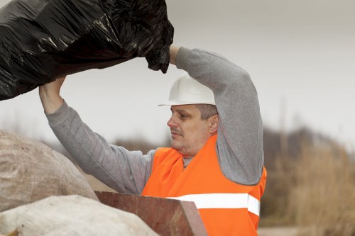 Team wearing PPE during rubbish removal at a property